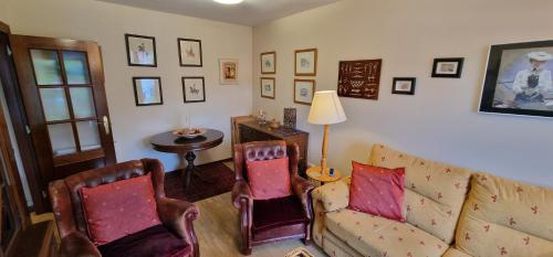 a living room with a couch and chairs and a table at Esguilu - VUT-5709-AS in Colunga