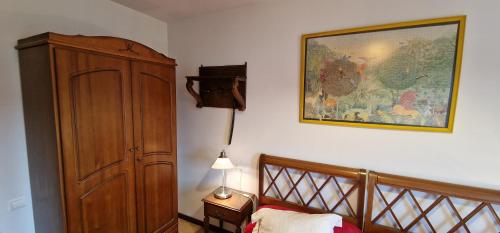 a bedroom with a bed and a painting on the wall at Esguilu - VUT-5709-AS in Colunga