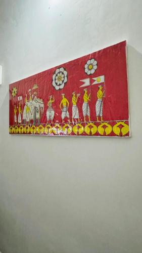 a picture of a painting on a wall at Gagana Vila in Kandy
