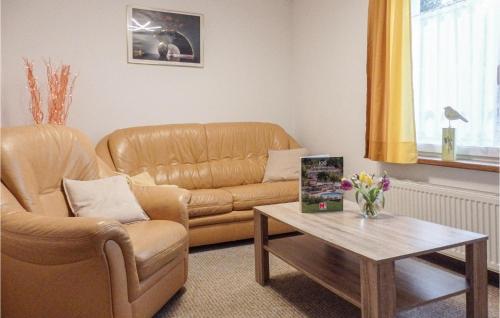 a living room with a couch and a coffee table at 1 Bedroom Cozy Apartment In Marlow in Blankenhagen