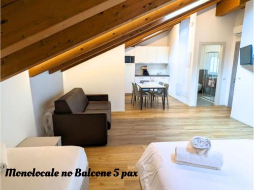 a living room with a couch and a table at Superior Beach Aparthotel in Lido di Jesolo
