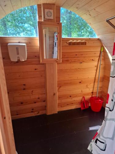 a view of the inside of a tiny house at Kempings Mežmalas in Usma