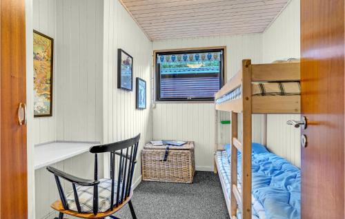 a small room with a bunk bed and a ladder at Two-Bedroom Holiday Home Nibe With A Fireplace 06 in Farstrup