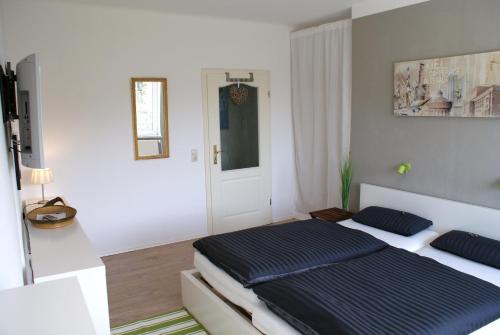 Posteľ alebo postele v izbe v ubytovaní Das Weiße Haus Am Meer