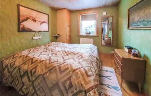 a bedroom with a bed and a dresser and a window at Lovely Home In Farhult With Kitchen in Farhult