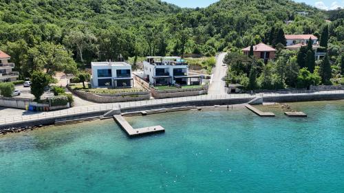 an aerial view of a river with a fountain at Cassiopeia - Seaside Retreat in Omišalj