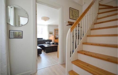 a hallway with stairs leading to a living room at 3 Bedroom Stunning Home In Tønder in Tønder
