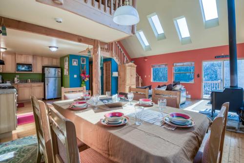 a kitchen and dining room with a table and chairs at Dream Sea Chalet in Yachats