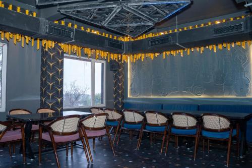 a room with a bunch of chairs and a table at Hotel W Grand - A Boutique Hotel in Haridwār