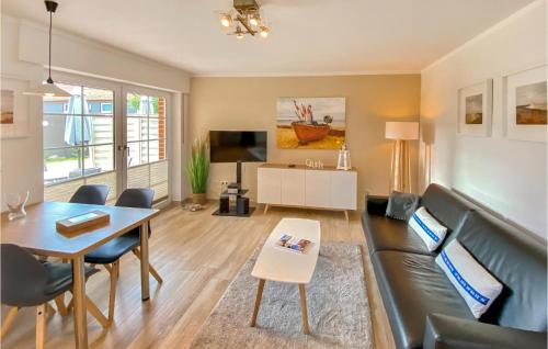 a living room with a couch and a table at Strandhafer in Gollwitz