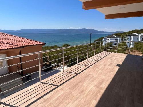 a balcony with a view of the ocean at Вила in Asprovalta