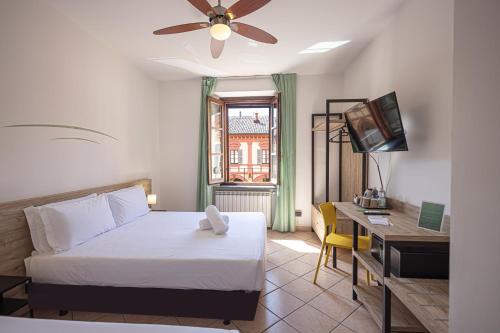 Postel nebo postele na pokoji v ubytování Hotel Tornielli 9 by LVG Hotel Collection