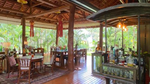 a restaurant with tables and chairs in a room at Nan Seasons Boutique Resort in Nan