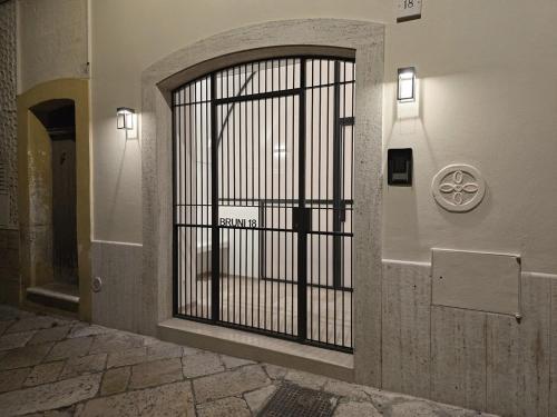 a door with a gate in a building at Bruni 18 in Fasano
