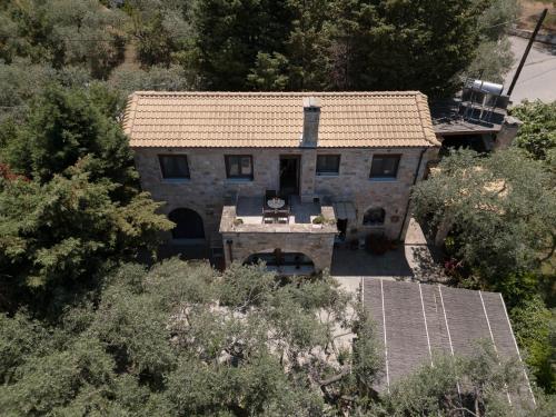 an aerial view of a stone house with a roof at Millstone Summerhouse in Pachis