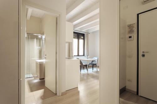 a room with a table and a dining room at Opera Residence in Bologna