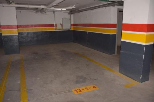 an empty parking garage with a yellow tape on the floor at Magnifique appartement à Riad Garden in Marrakech