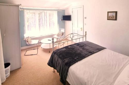 Ένα ή περισσότερα κρεβάτια σε δωμάτιο στο Oak Tree Rooms LTD