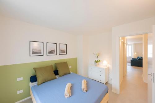 Postel nebo postele na pokoji v ubytování Torre Apartments Lake Como