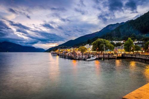 a view of a body of water with boats in it at Oaks Queenstown Club Suites in Queenstown