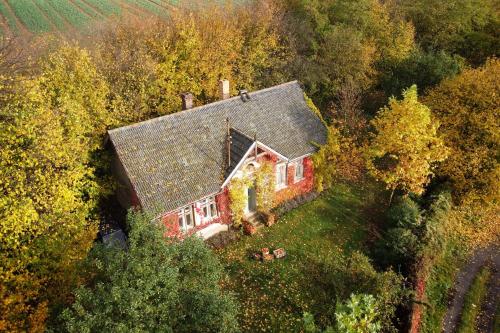 an aerial view of a house in the forest at Romantický dům na Kokořínsku in Katusice