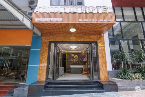a boutique hotel with a sign over the door at Aquatic Hotel Cat Ba in Cat Ba