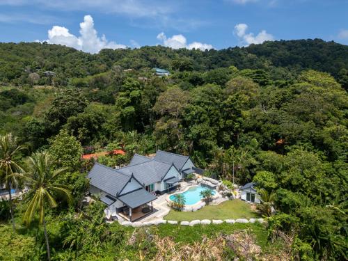 an aerial view of a house in the forest at Villa Olympus Ocean Vista Kata Beach in Kata Beach
