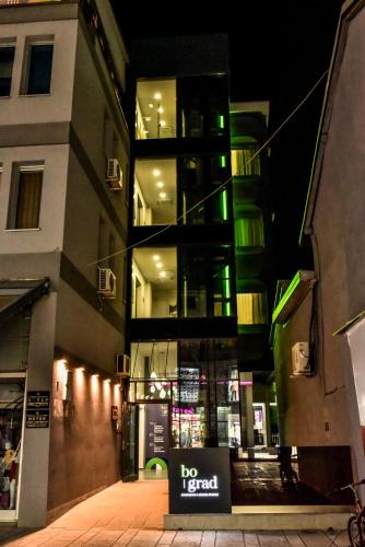 a building with a no food sign in front of it at Hotel Bograd - Apartments & Lounge Station in Struga