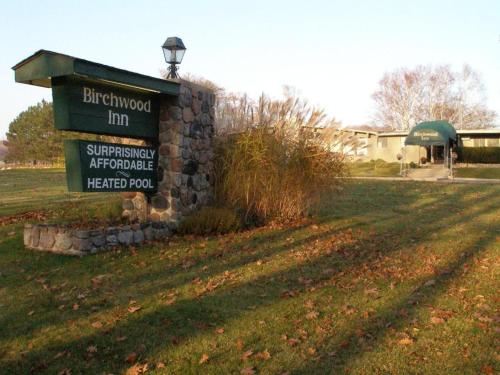 a sign in the middle of a field at Birchwood Inn in Harbor Springs