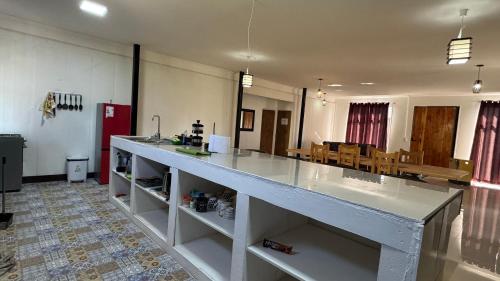 a large kitchen with a large counter in a room at La Finca - Santa Cruz - Chile in Santa Cruz