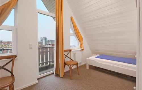 a small bedroom with a bed and a window at Gorgeous Apartment In Rechlin With Wifi in Rechlin