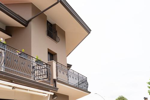 a building with balconies on the side of it at Hotel Oberdan Ristorante Pizzeria in Concordia Sagittaria