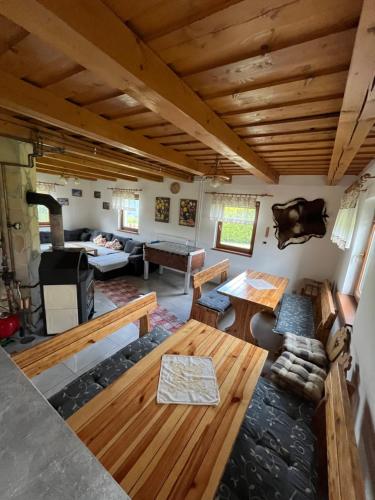 a living room with a couch and a table at Chata Nikol in Oravská Lesná