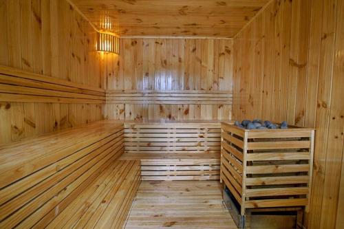 a sauna with wooden walls and a wooden floor at Friendly Villa Hoian in Hoi An