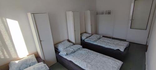 a room with three bunk beds and a mirror at Jagiellońska 20 in Kielce