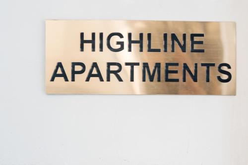 a sign with the words highline apartments on a wall at HIGHLINE DOWNTOWN ApartHotel OLDTOWN UNIRII SQUARE in Bucharest