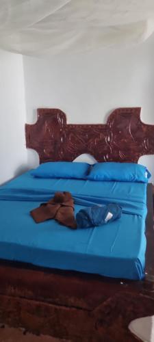 Postel nebo postele na pokoji v ubytování Daya House karibu