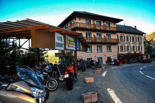 a group of motorcycles parked in front of a building at Belvédère Relais Motos in Séez