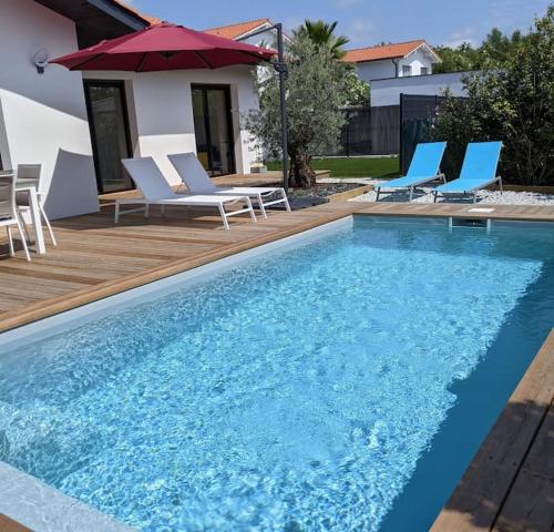 Photo de la galerie de l'établissement Maison Familiale avec Piscine, à Angresse
