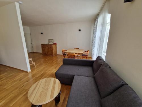 a living room with a couch and a table at Casa di Giovanni - Österreich in Frohnleiten