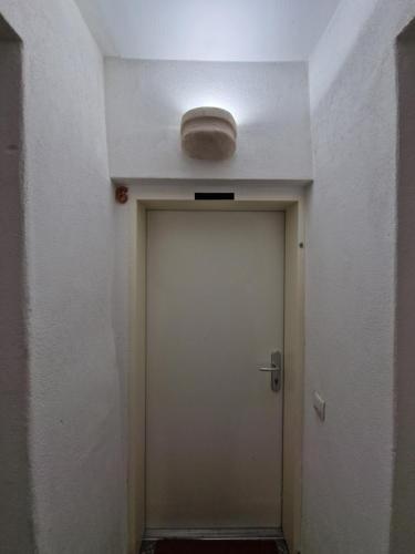 a hallway with a door with a light on the ceiling at Casa di Giovanni - Österreich in Frohnleiten