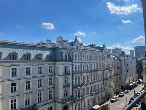 a view of a large building in a city at ComeWa Apartments in Warsaw