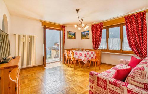 a living room with a table and a dining room at Casa Lucia in Brusson
