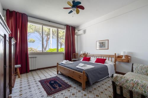 En eller flere senge i et værelse på Le Casette all'Addaura by Domus Sicily