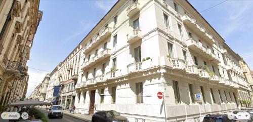 a white building on the side of a street at Turin Central Cavour in Turin