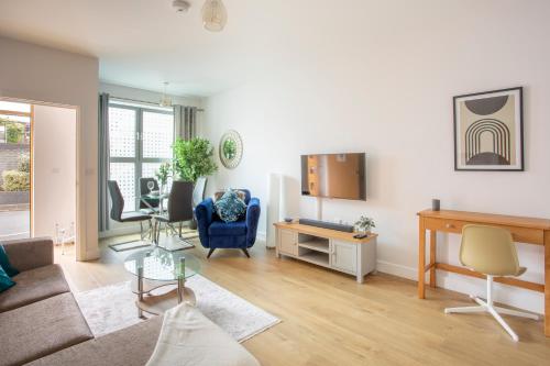 a living room with a couch and a table at 1 Bed Apartment - Redhill Central, Surrey, Gatwick #2 in Redhill