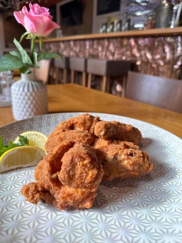 a plate of fried food on a table at Hotel Raffel in Jennersdorf