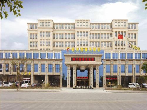 a large building with a gate in front of it at Chengdu Haotian Guotai Hotel in Chengdu