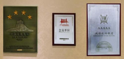 three framed posters hanging on a wall at Chengdu Haotian Guotai Hotel in Chengdu