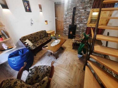 a living room with couches and a table at Apartment Bike in Žminj